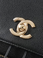 Chanel CC charm on black grained leather bag with gold-tone finish