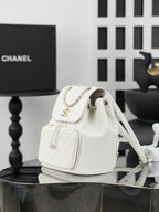 White fabric bucket-style shoulder bag with flap and chain strap