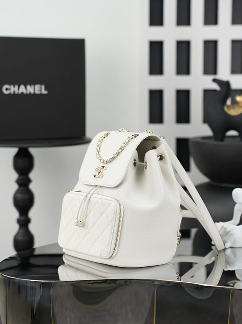 White fabric bucket-style shoulder bag with flap and chain strap