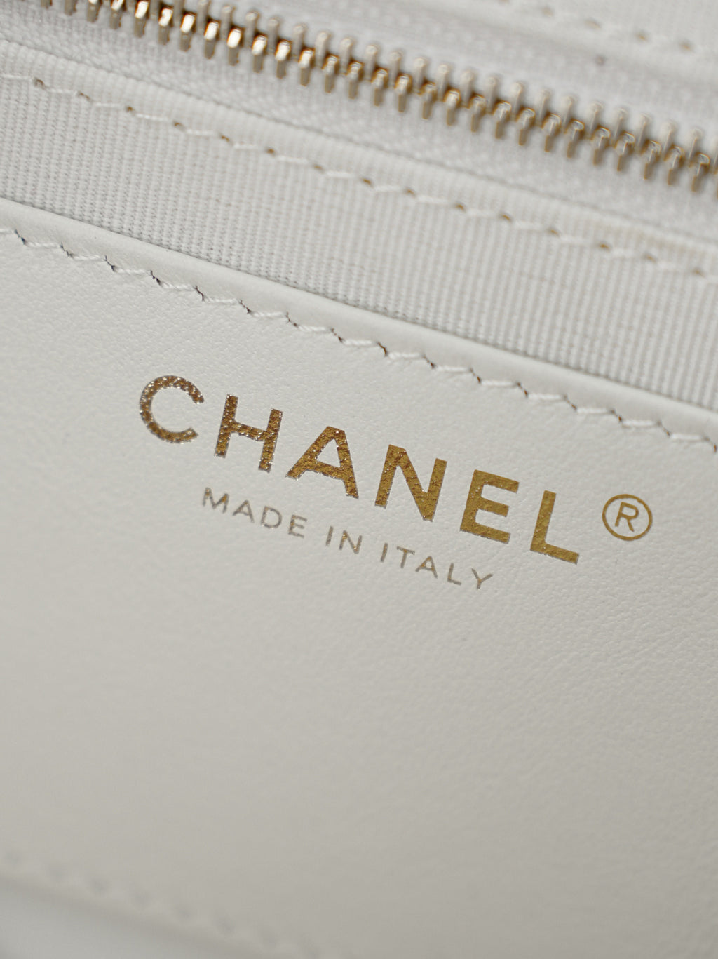 White bag lining with gold CHANEL lettering and Made in Italy label