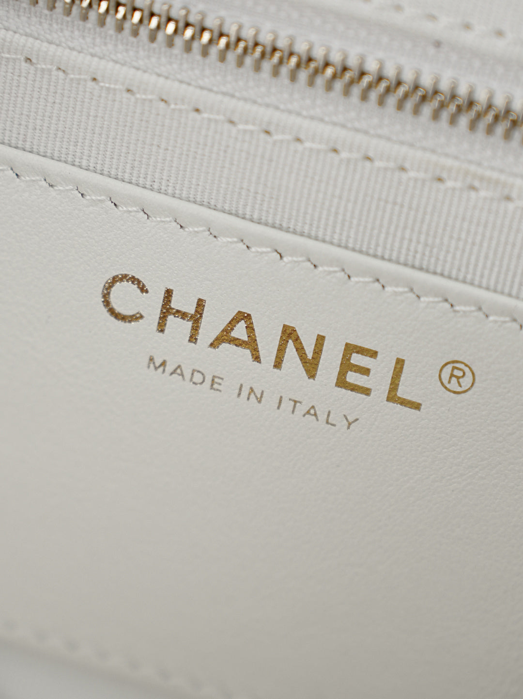 White bag lining with gold CHANEL lettering and Made in Italy label