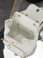 White leather shoulder bag interior view with zipper pocket and gold hardware