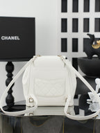 White flap shoulder bag with front pocket and adjustable shoulder strap