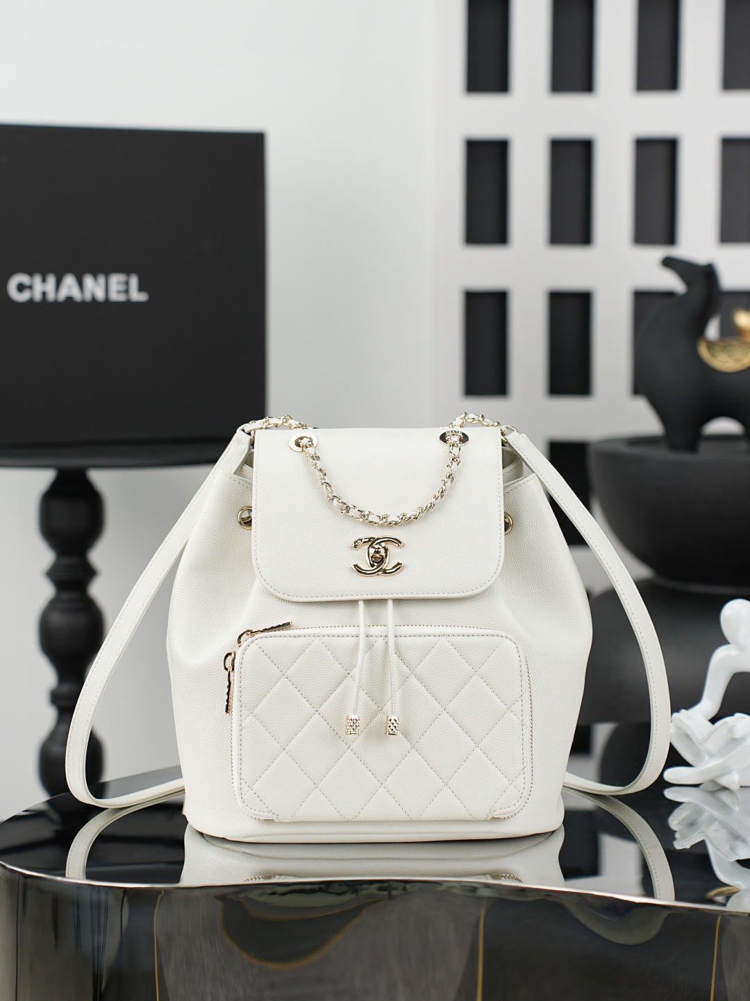 White quilted flap shoulder bag with chain strap and top handle