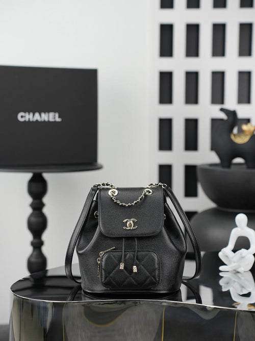 Chanel small black bucket bag with chain strap and flap front pocket