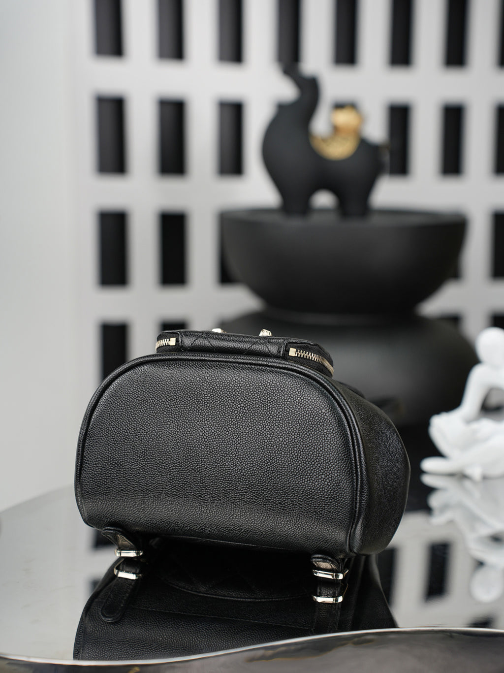 Chanel black mini bucket bag with zip top and gold-tone hardware