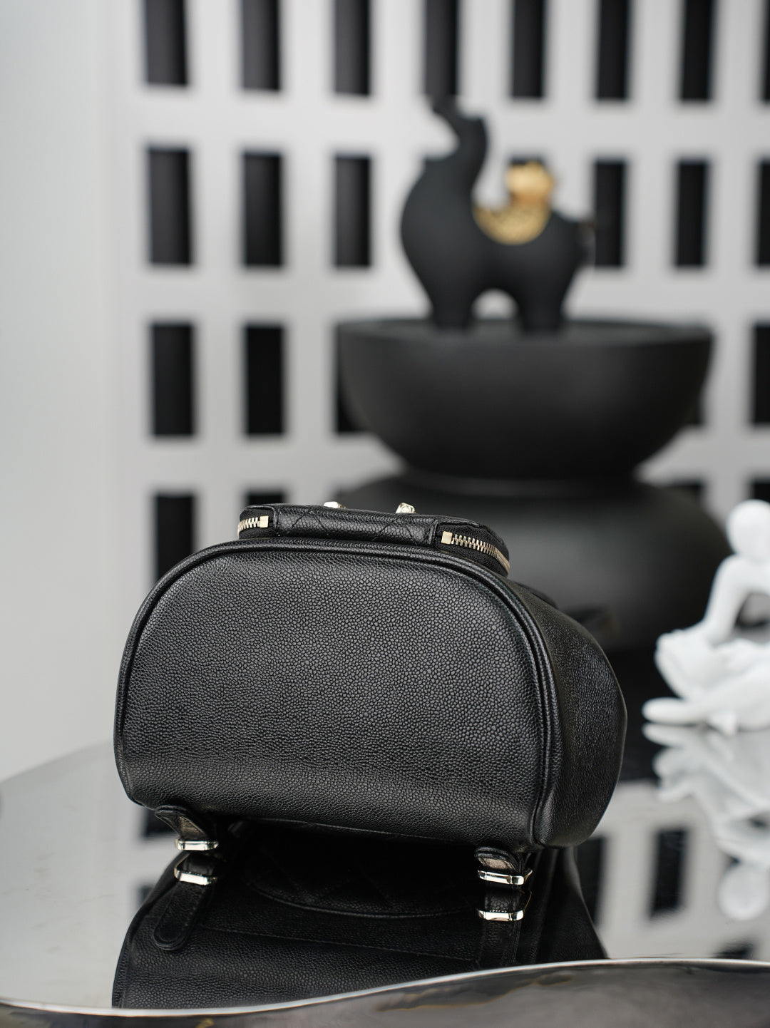 Chanel black mini bucket bag with zip top and gold-tone hardware