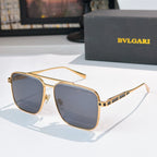 Sunglasses with gold frames and blue gradient lenses, rectangular rounded shape