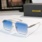 Sunglasses with silver frames and blue gradient lenses, rectangular rounded shape