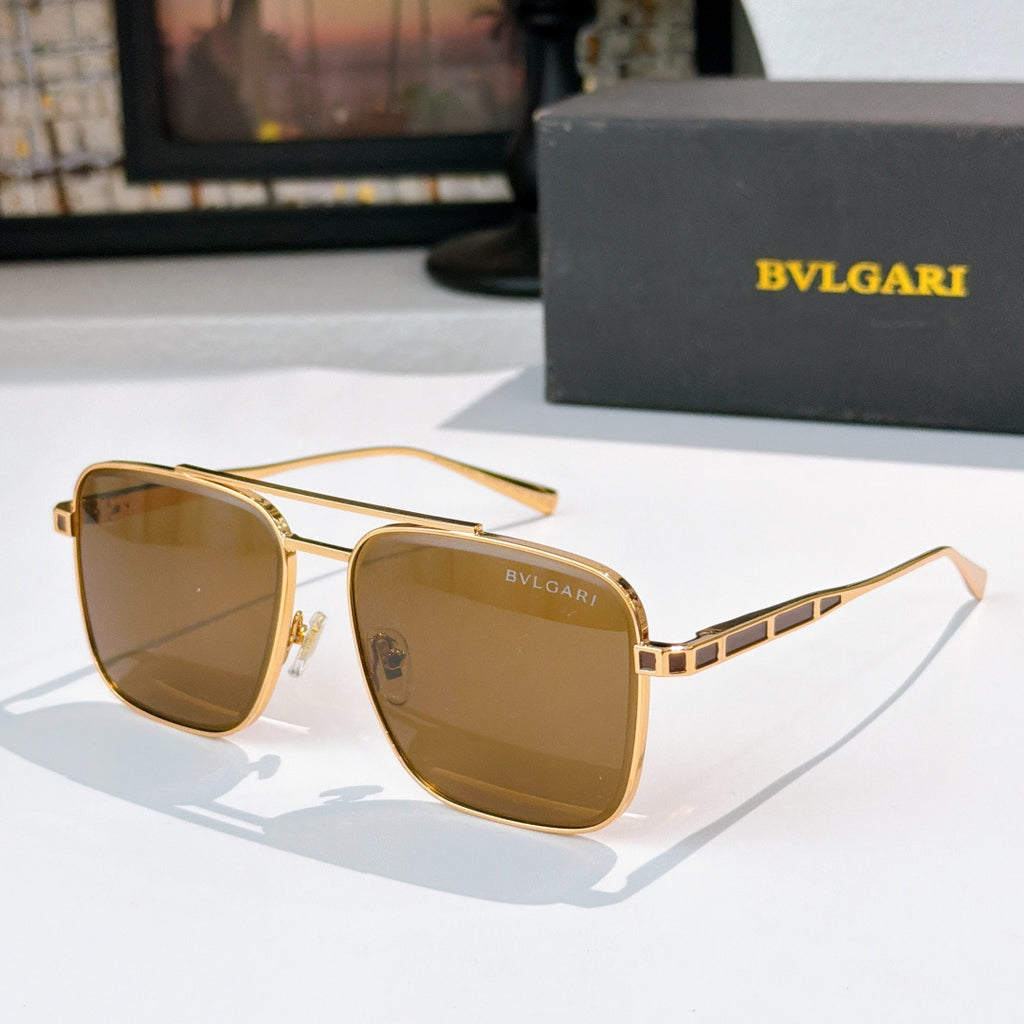 Sunglasses with gold frames and brown gradient lenses, rectangular rounded shape
