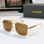 Sunglasses with gold frames and brown gradient lenses, rectangular rounded shape
