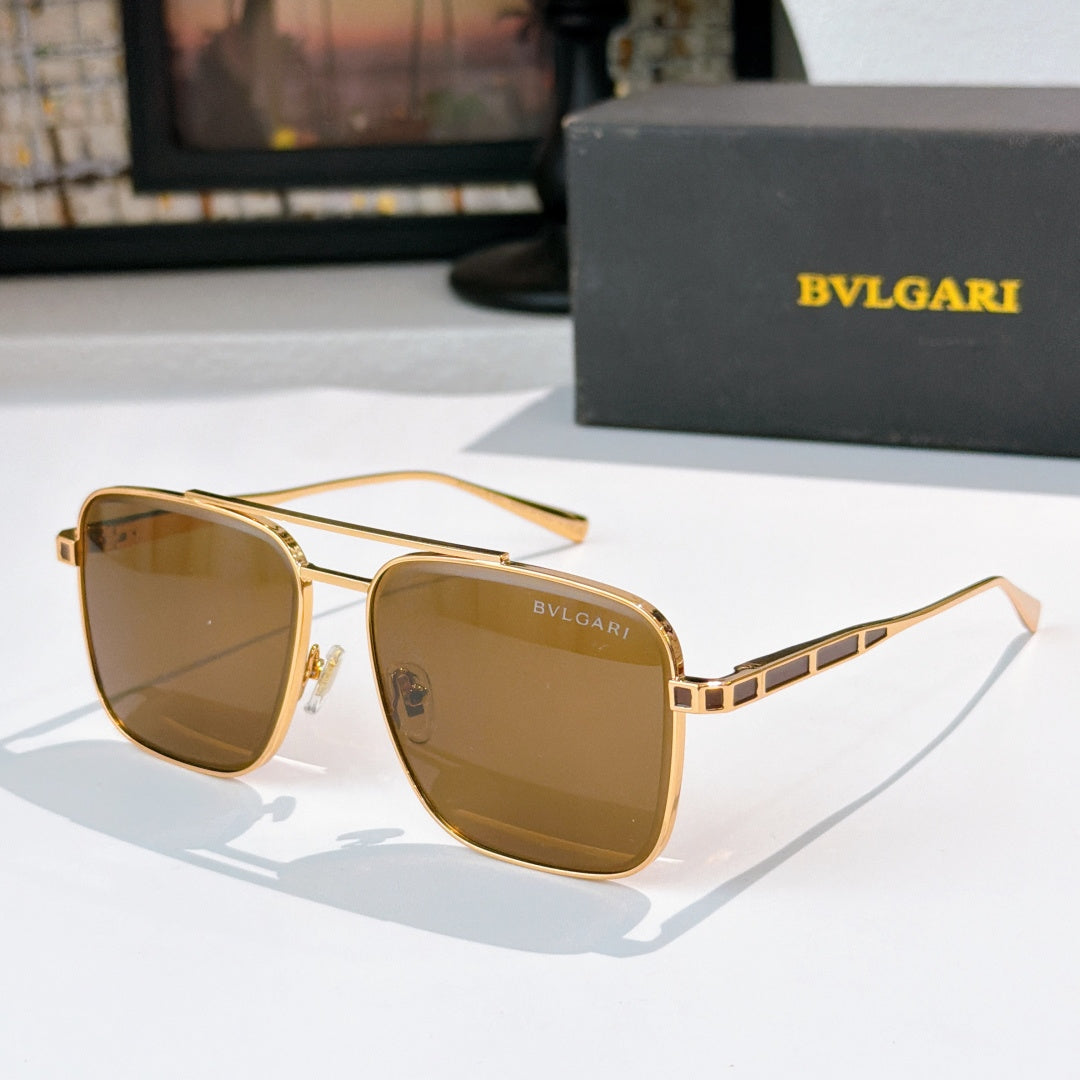 Sunglasses with gold frames and brown gradient lenses, rectangular rounded shape