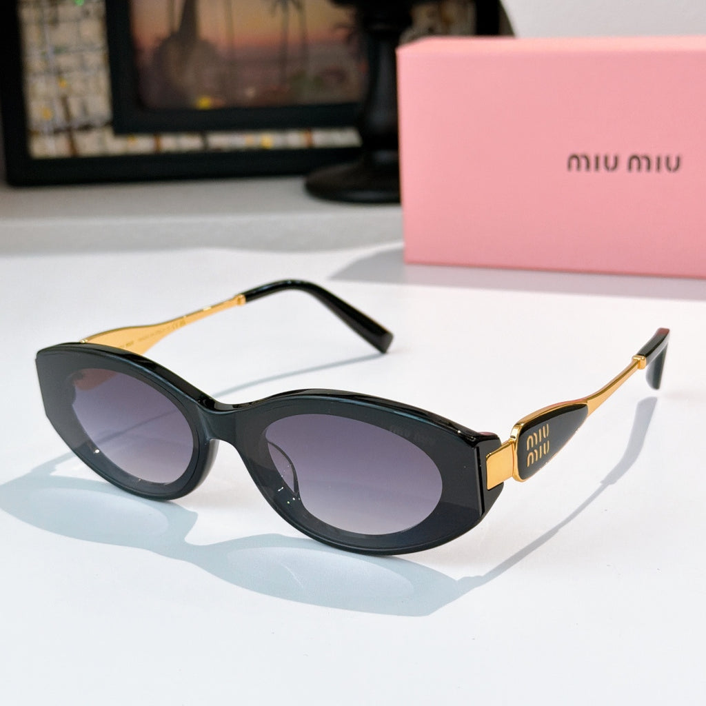 Black oval sunglasses with dark lenses and gold accents