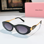 Black oval sunglasses with dark lenses and gold accents