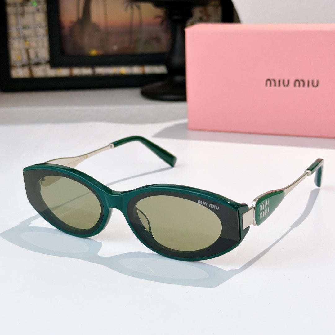Green oval sunglasses with olive-tinted lenses and silver-toned temple accents