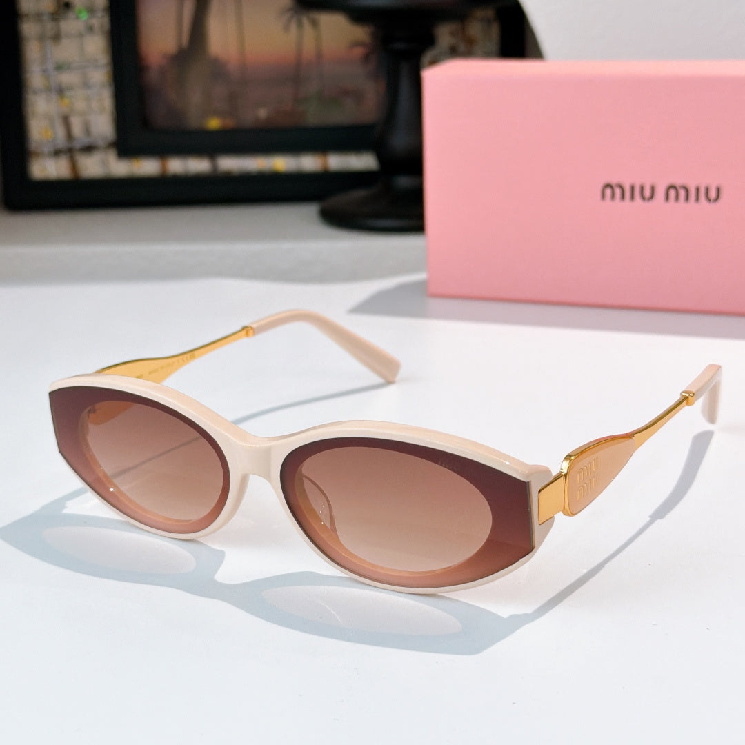 Cream oval sunglasses with rose-tinted lenses and gold temple details