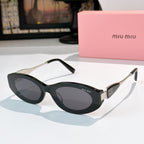 Black oval sunglasses with dark lenses and silver-toned temple accents