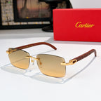 Sunglasses with gold frames and warm amber-tinted lenses, rectangular cat-eye shape