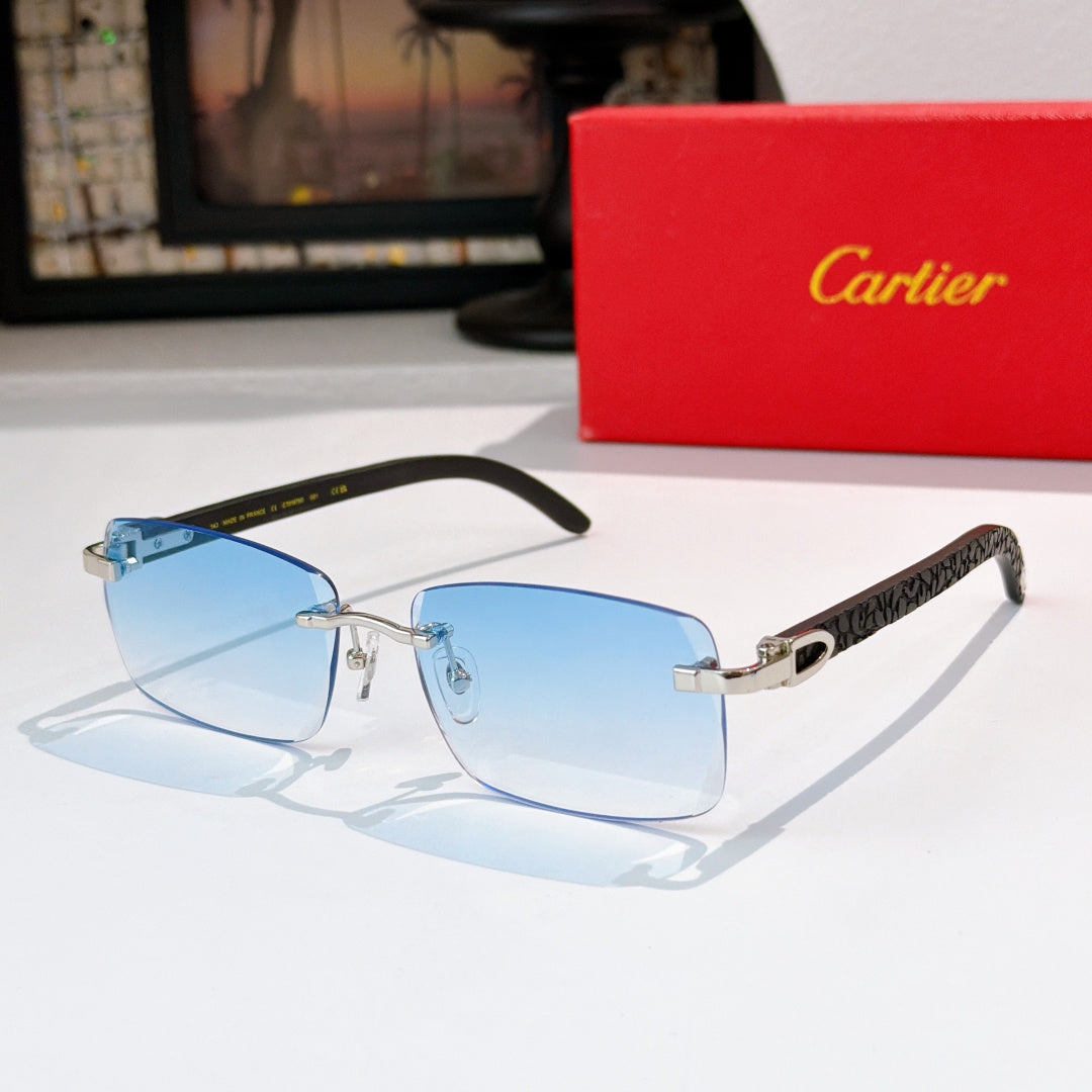 Sunglasses with gold frames and light blue tinted lenses, rectangular cat-eye shape
