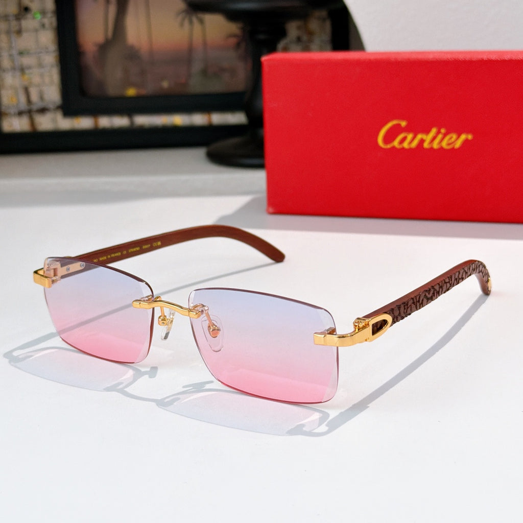 Sunglasses with gold frames and pink-tinted lenses, rectangular cat-eye shape