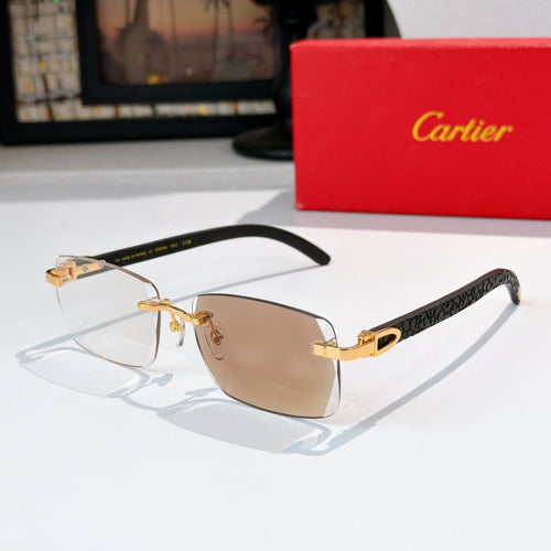 Sunglasses with gold frames and amber-tinted lenses, rectangular cat-eye shape