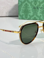 Gucci sunglasses side view with gold temple and tortoiseshell frame, green lens