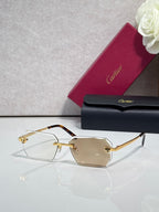 Cartier rectangular eyeglasses with gold frame, clear lenses, gold bridge detail
