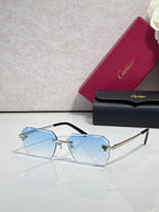 Cartier rectangular eyeglasses with black temples, blue-tinted lenses, gold hardware