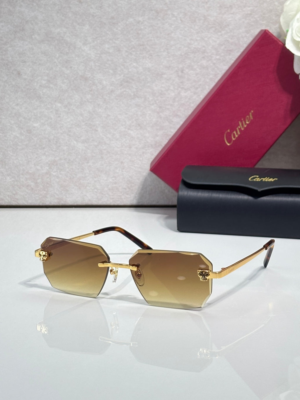 Cartier rectangular eyeglasses with tortoiseshell temples, amber lenses, gold accents