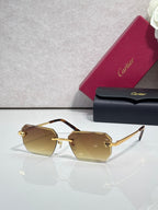 Cartier rectangular eyeglasses with tortoiseshell temples, amber lenses, gold accents