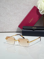 Cartier rectangular eyeglasses with tortoiseshell temples, pale lenses, gold accents