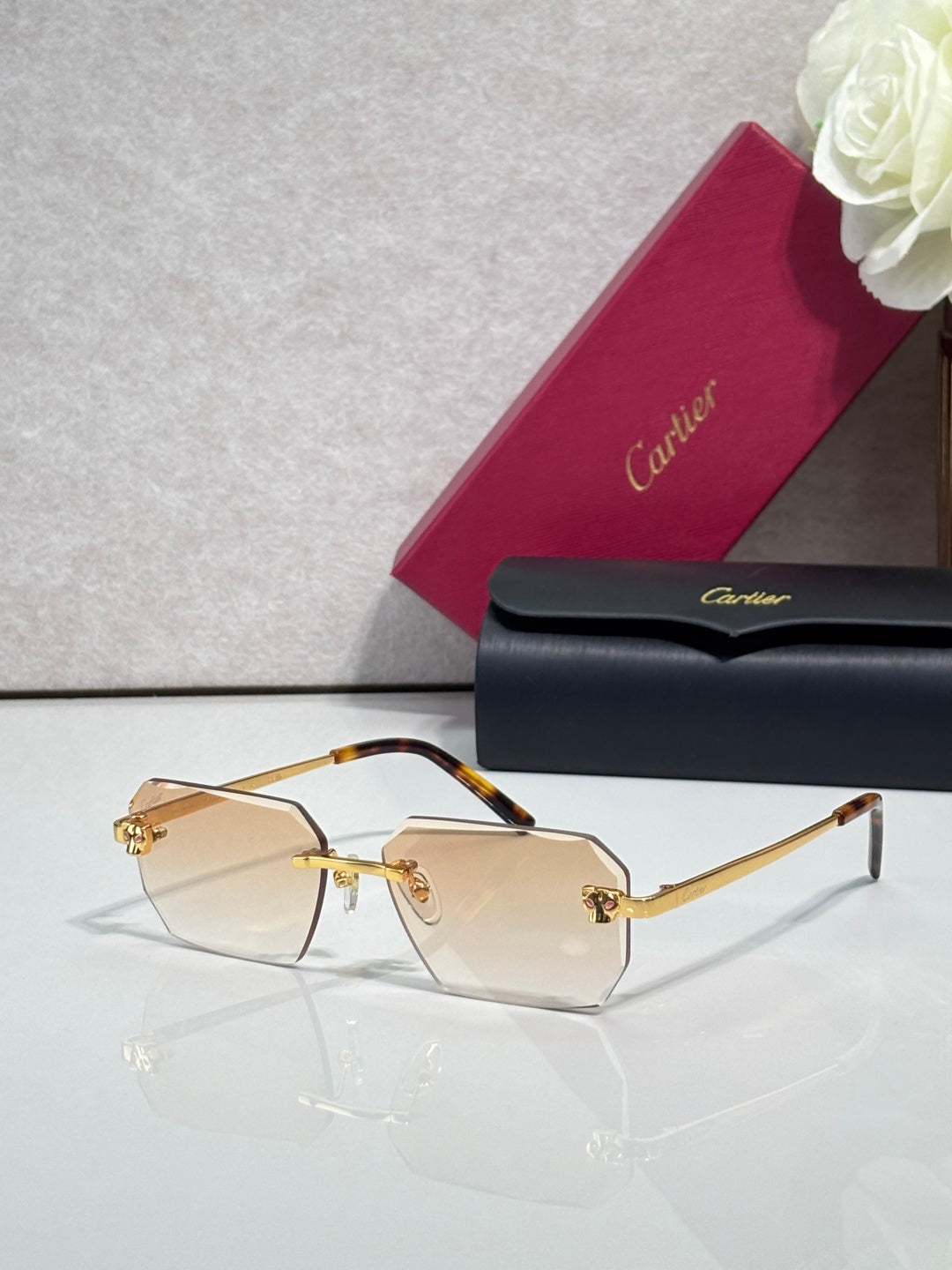 Cartier rectangular eyeglasses with tortoiseshell temples, pale lenses, gold accents