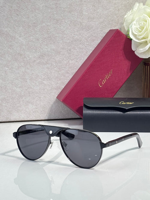 Cartier oval sunglasses with dark lenses and black frame, gold metal accents