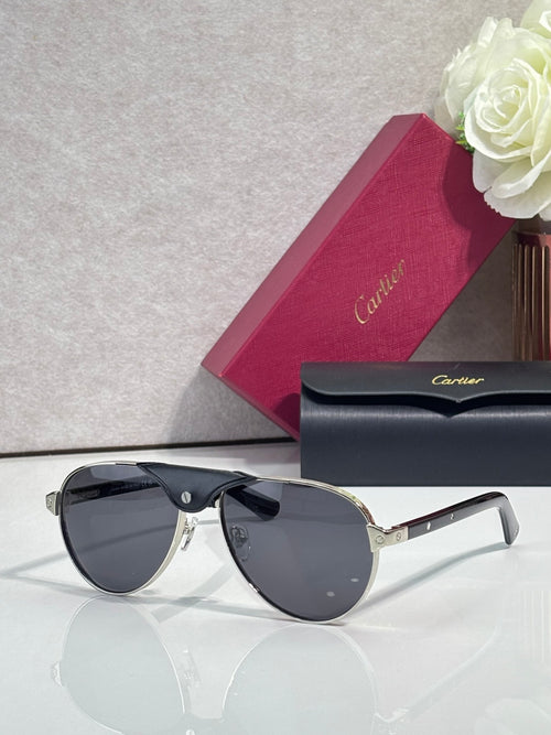 Cartier oval sunglasses with dark lenses and black frame, gold bridge details