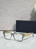 Dior eyeglasses with clear green frames and textured gold temple detail
