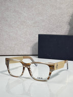 Dior eyeglasses with clear tan frames and textured gold temple with Dior logo