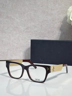 Dior eyeglasses with dark frames and textured gold temple with Dior logo