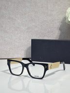 Dior eyeglasses with dark frames and textured gold temple with Dior logo