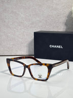 Chanel eyeglasses with tortoise brown rectangular frame and clear lenses, gold logo detail