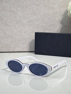 White Dior glasses with dark blue round lenses and star detail on temple