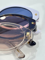 White Dior glasses with navy lenses and star detail on side