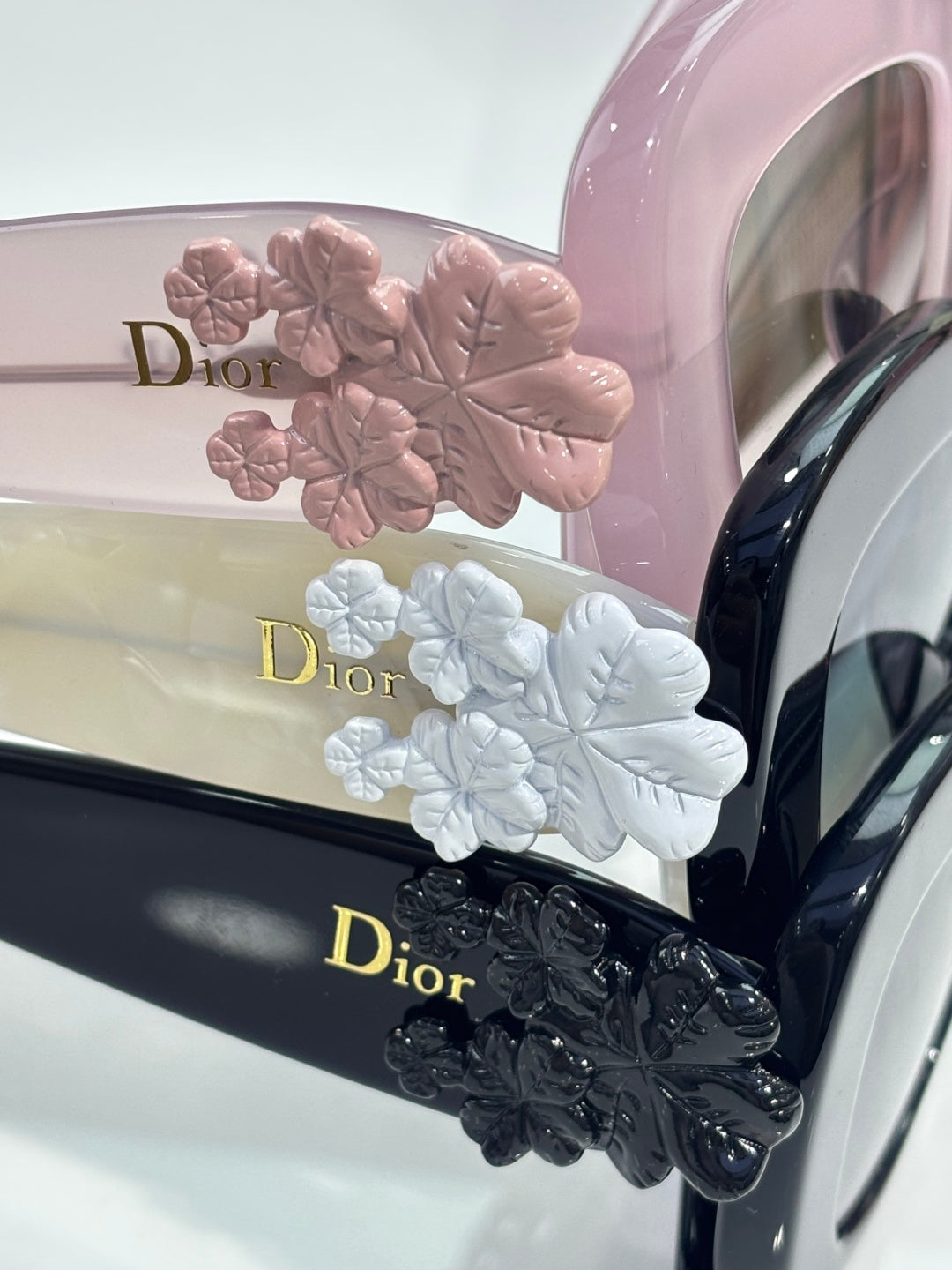 Dior glasses temple detail with floral embellishments and Dior logo on the arm.