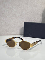 Gold round cat-eye sunglasses with brown tinted lenses and Dior logo on temple