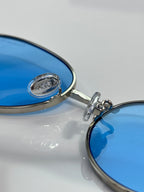 Blue mirrored lens with metal eyeglass hinge and Dior logo detail