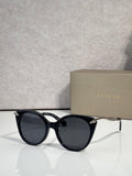 Bvlgari sunglasses, black rounded frames with gold-tone temple tips and dark lenses