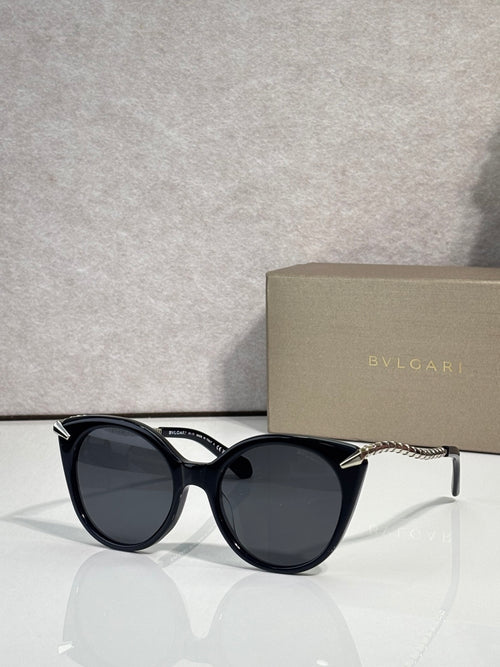 Bvlgari sunglasses, black rounded frames with gold-tone temple tips and dark lenses