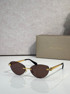 Bvlgari eyeglasses with dark brown lenses, gold frame and black temple tips