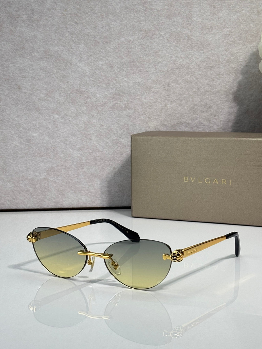 Bvlgari eyeglasses with olive-gold lenses, gold frame and black temple tips