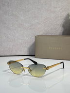 Bvlgari eyeglasses with olive-gold lenses, gold frame and black temple tips