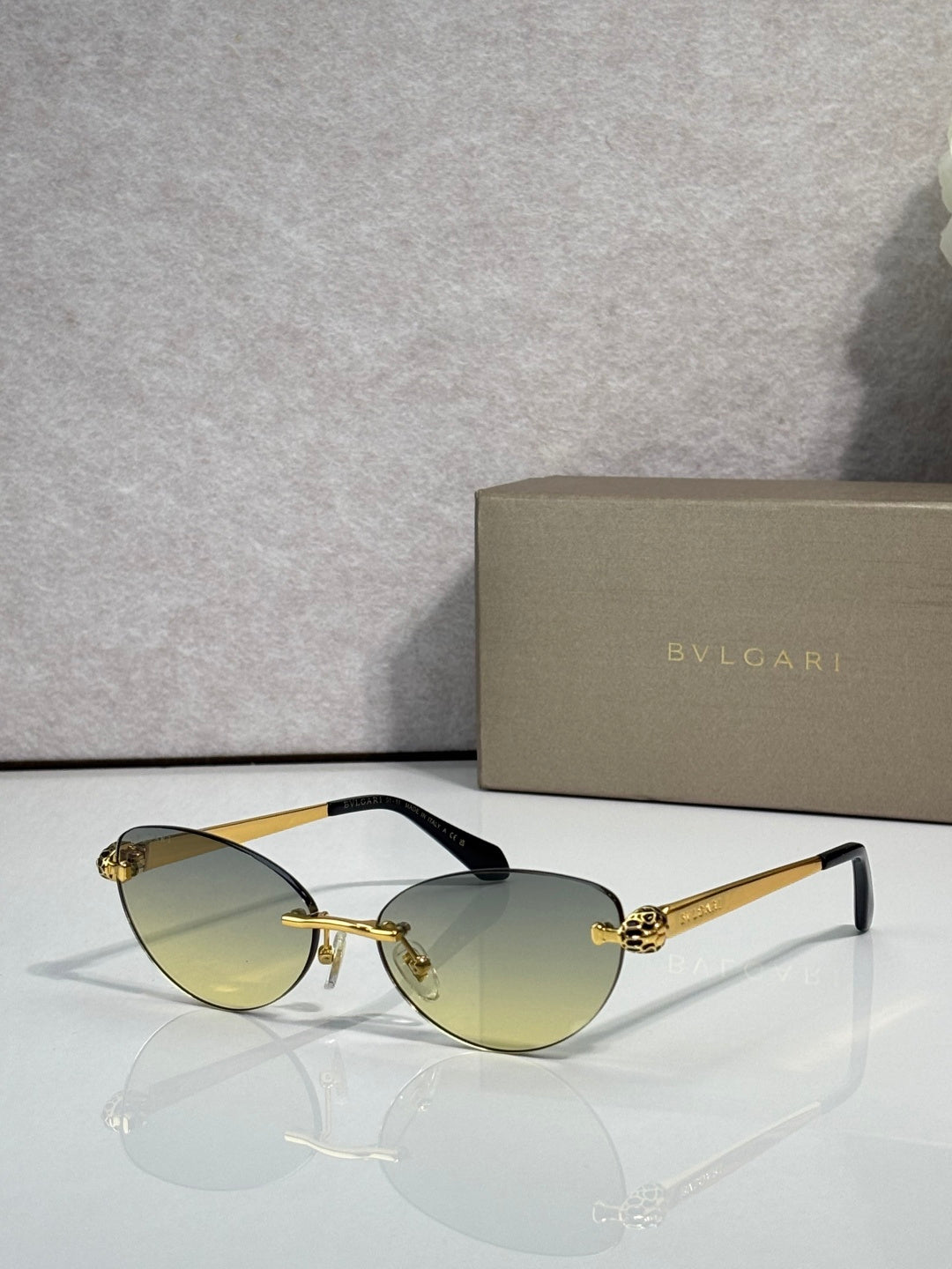 Bvlgari eyeglasses with olive-gold lenses, gold frame and black temple tips